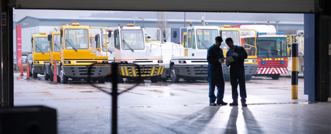 Maintenance Workers Reviewing Plans