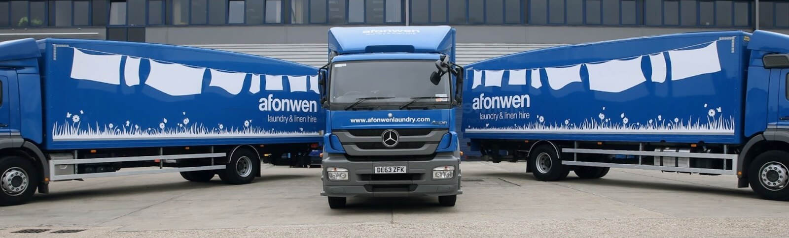 Afonwen blue truck fleet in front of loading docks
