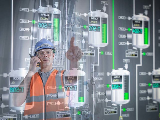 Image of a maintenance employee using asset data to perform predictive maintenance