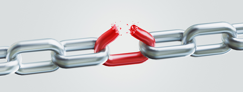 Stretched out chain with a broken link that is red.